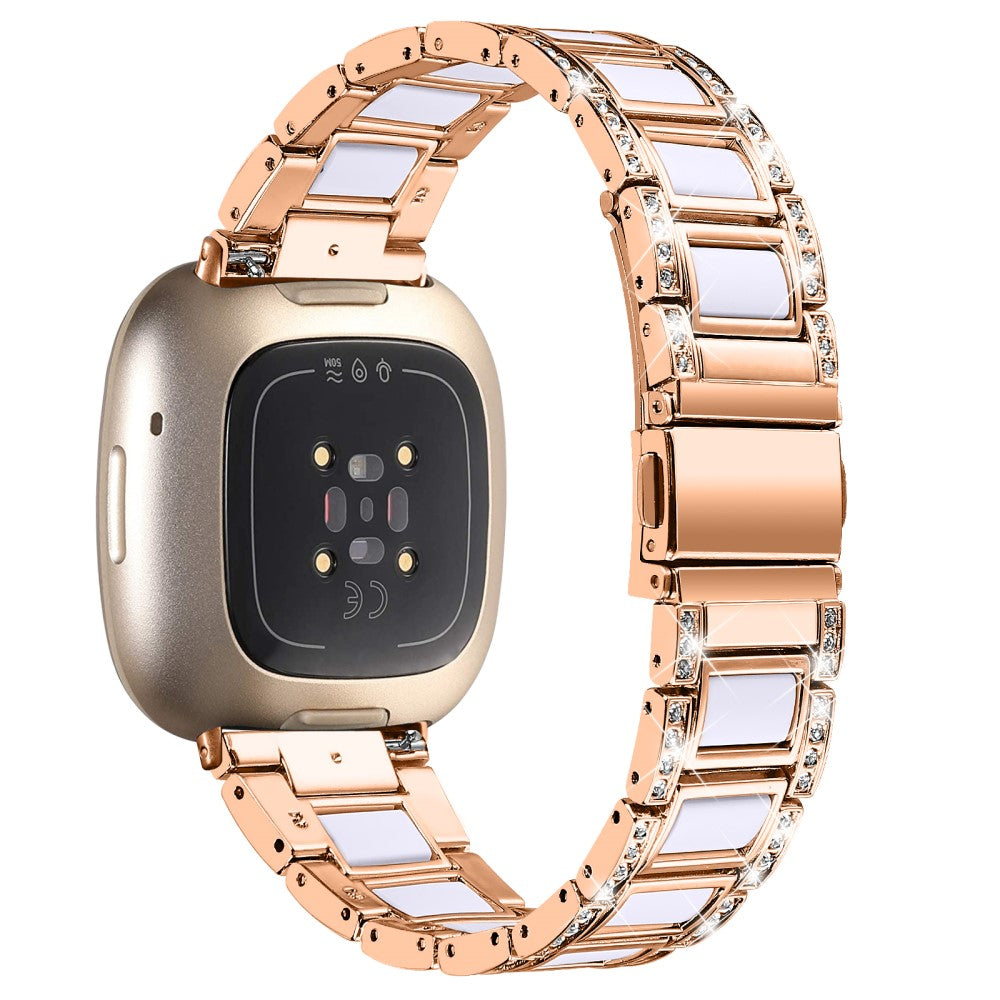 Fitbit versa rose 2024 gold white band